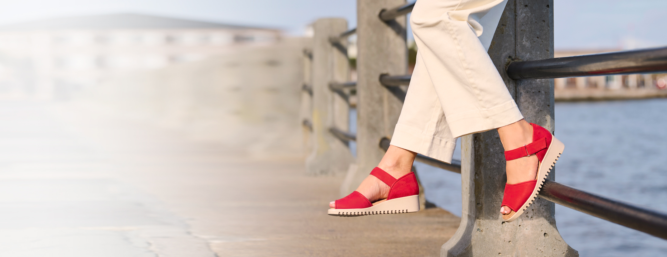 A woman wearing the Daniella in Red.