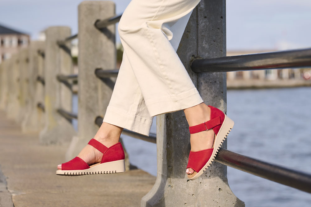 A woman wearing the Daniella in Red.